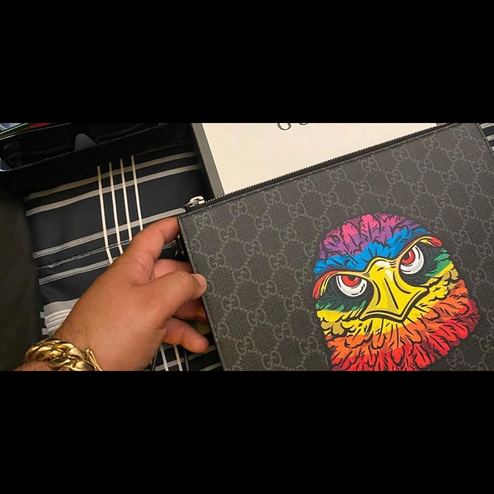 Gucci supreme pouch with eagle